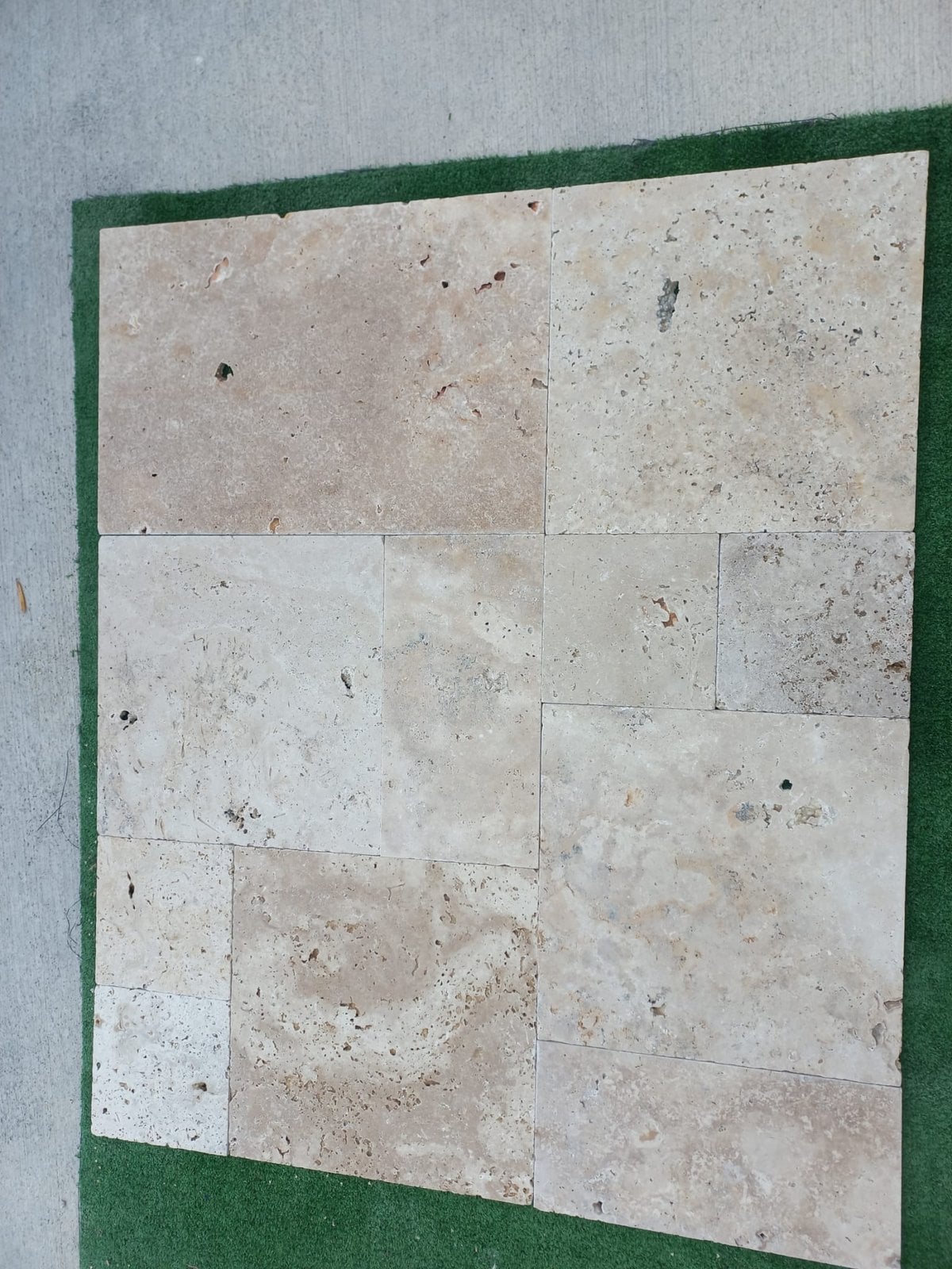 Detail of tumbled Classic Mix travertine with softly rounded edges