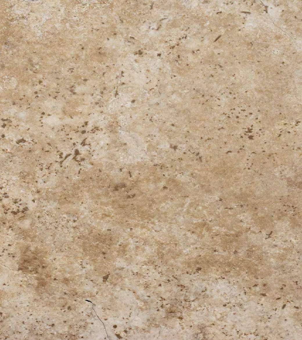 Classic cross-cut: beige travertine with a clouded pattern and dark speckles, honed, close-up