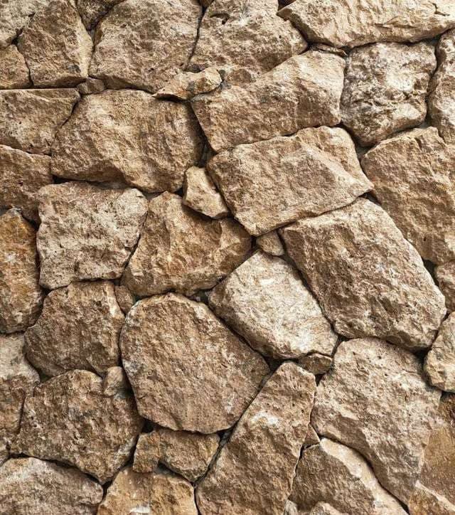 Rockface Noce: polygonale walnootbruine travertin stukken met breukvlak