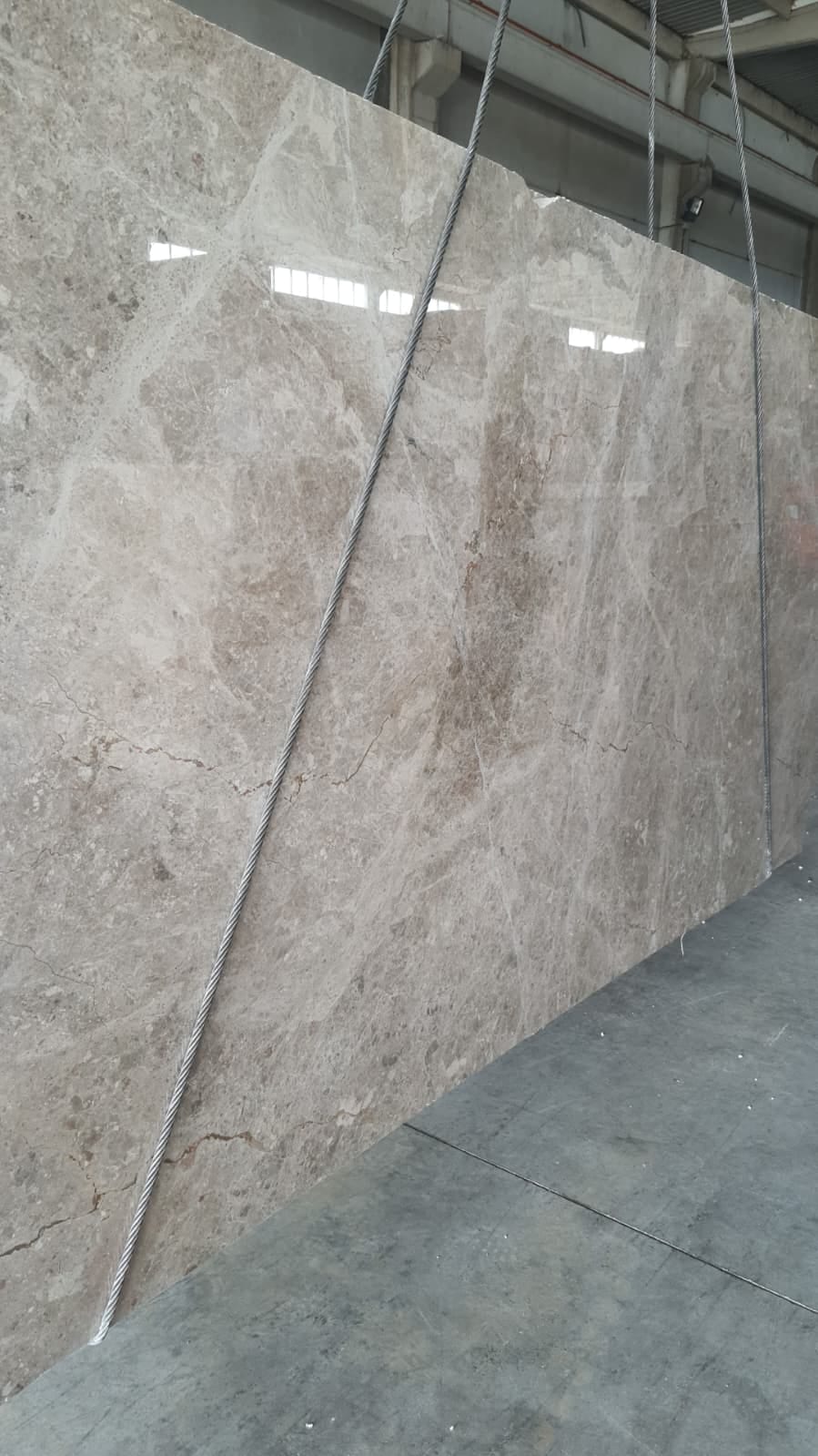 Slab Breccia Aurora marble: Breccia Aurora marble slab with beige and grey fragments, polished