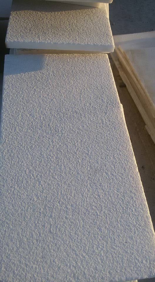 Bianco Ibiza marble pool coping: close-up of sandblasted white marble