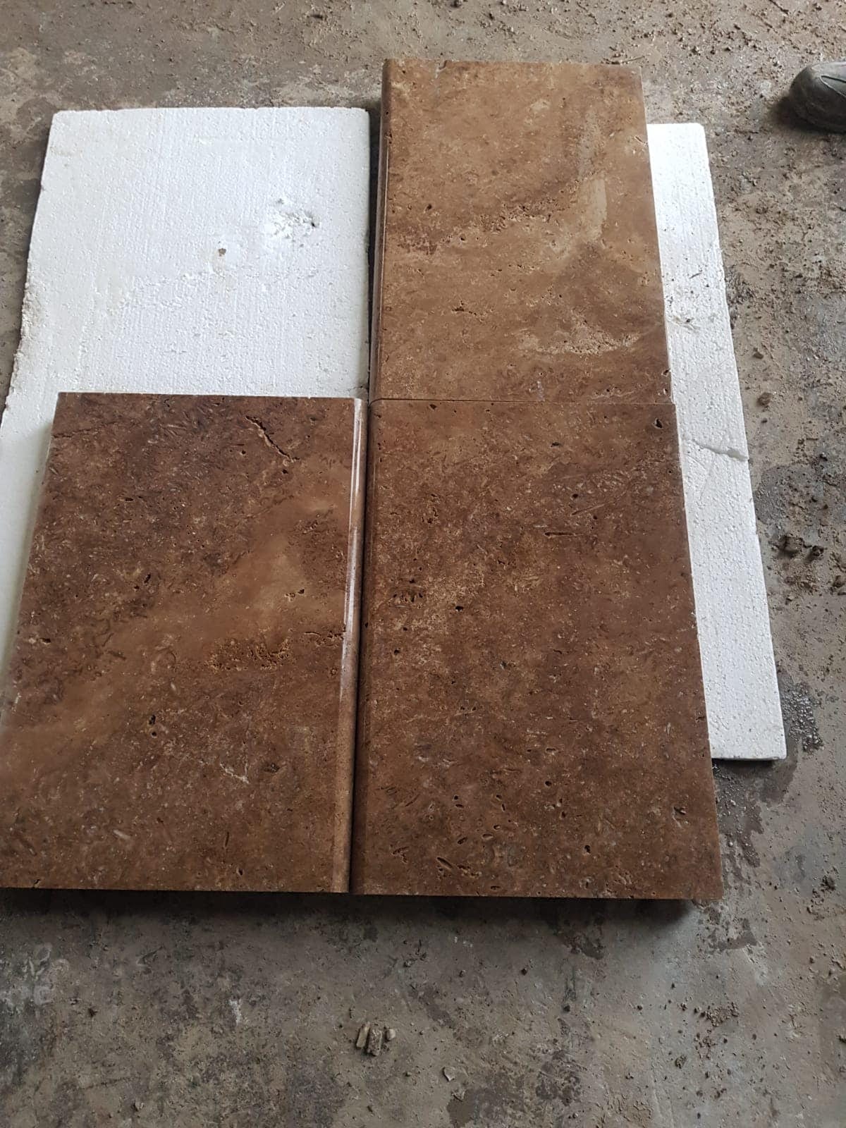 Walnut pool coping: close-up of the bullnose edge of a Walnut coping stone